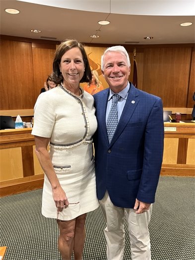 summit nj mayor and councilmember posing for photo in council chamber