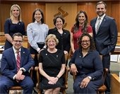 image of councilmembers posing for a photo in council chamber