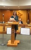 summit nj mayor at podium in council chamber