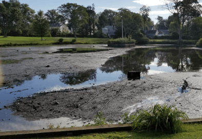 image of pond at summit golf course with low water level