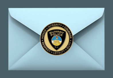 image of clipart blue envelope with summit police department seal in the center
