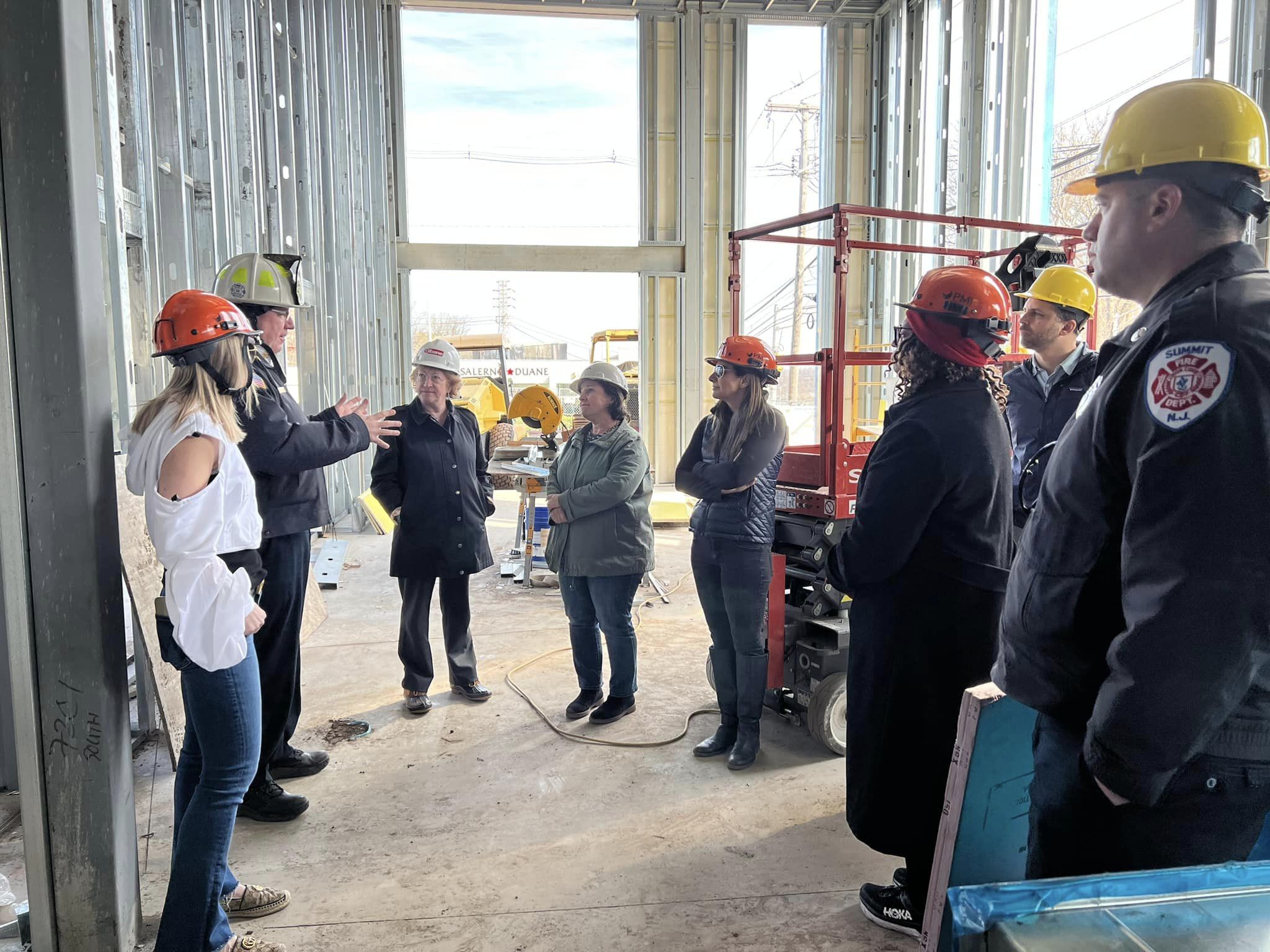 people in construction zone for tour