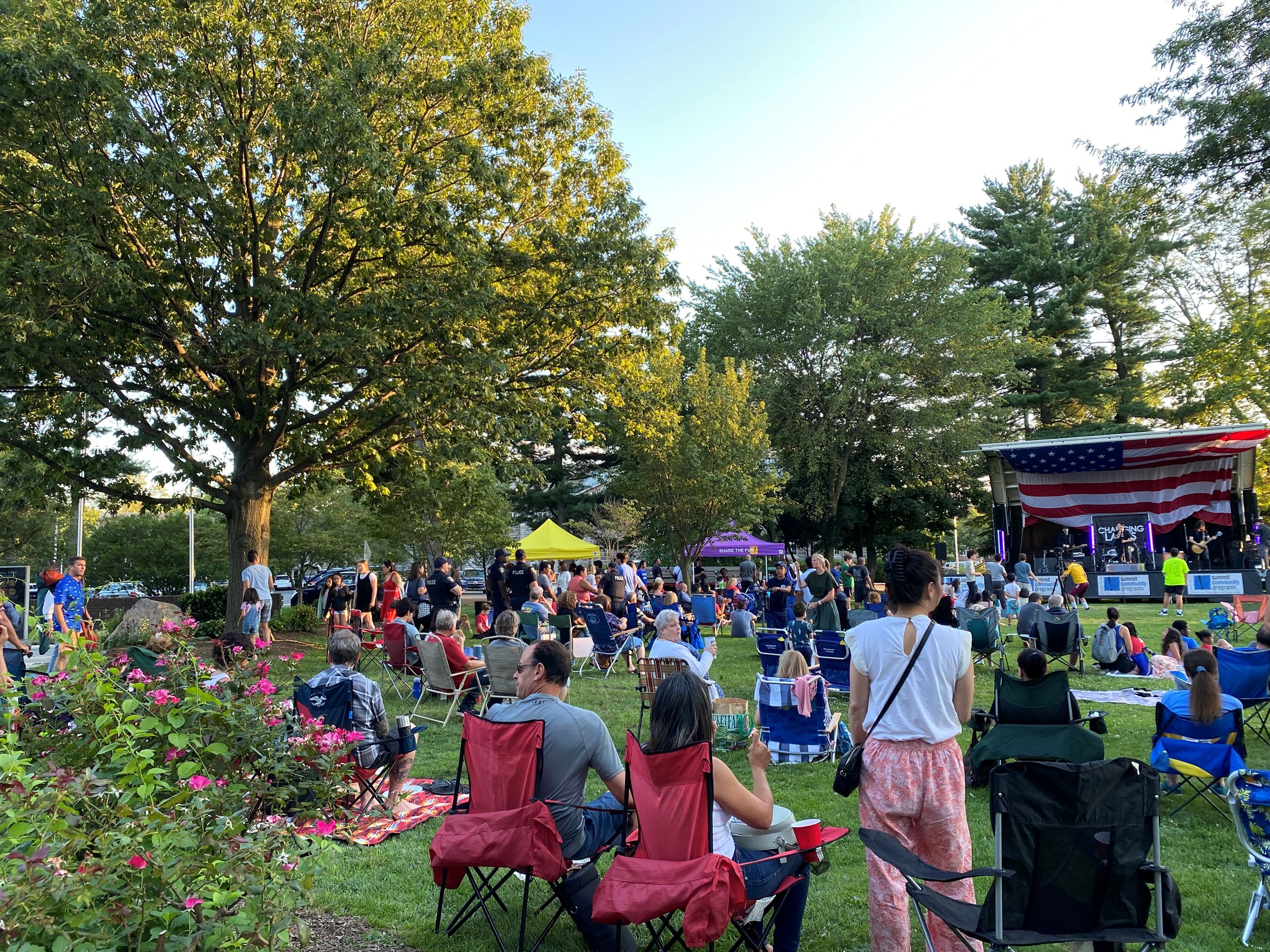 residents gathered on the village green for a summer concert