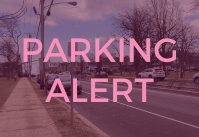 maroon tinted graphic with image of cars parked on a street in the background and text in front