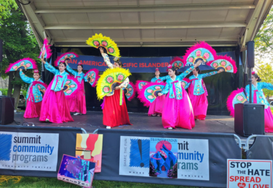 colorfully dressed performers on a stage