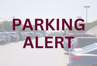 faded image of parking lot behind maroon text that reads parking alert