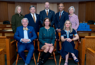group photo of councilmembers in council chamber