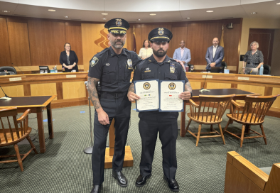 two police officers in council chamber