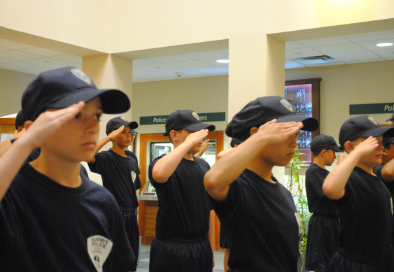 children saluting at summit police youth academy