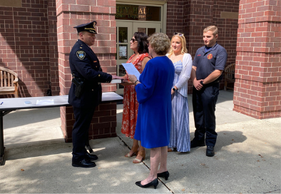 photo of police chief zagorski swearing in with mayor radest and family members next to him
