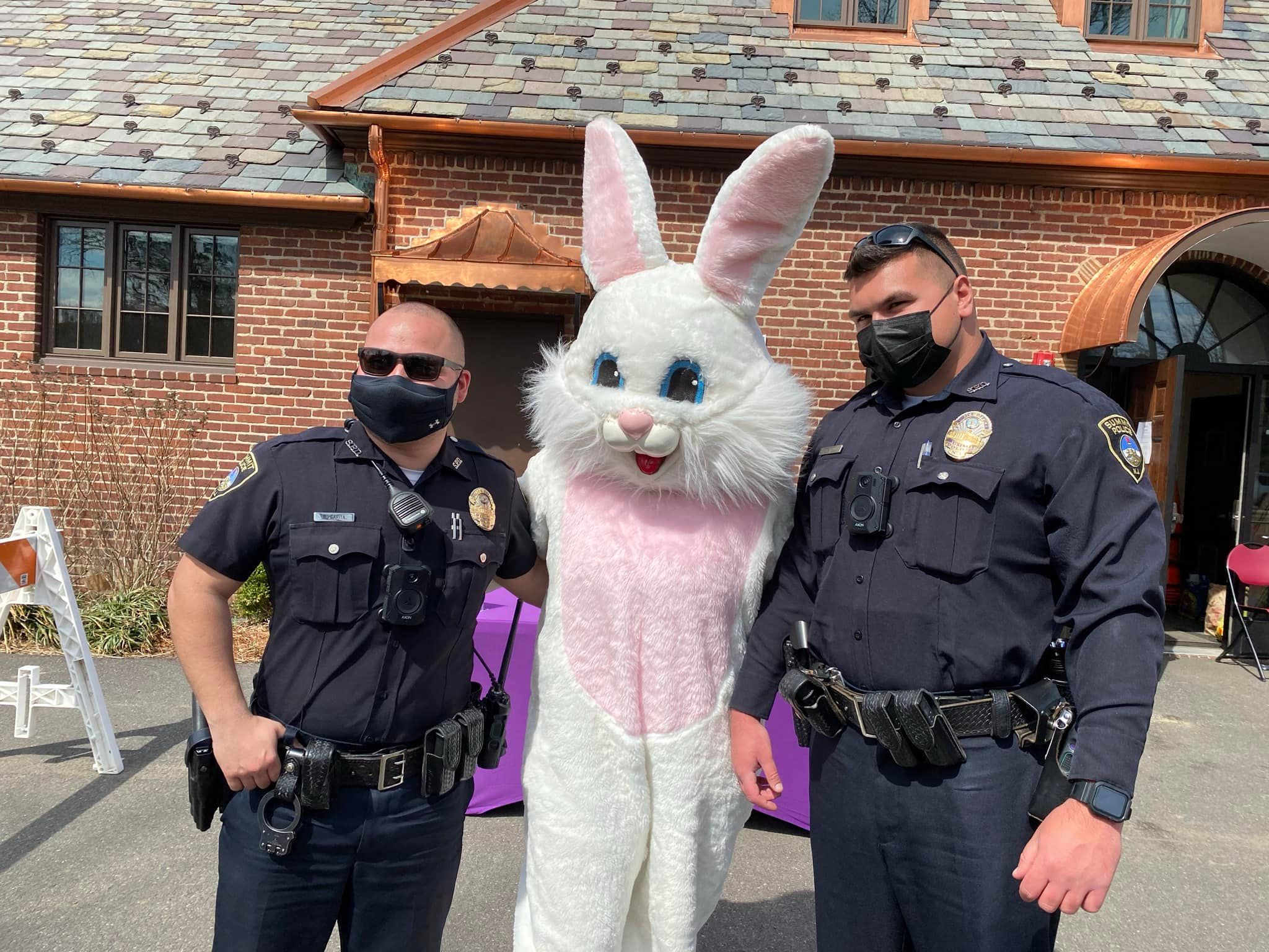 image of easter bunny with two summit police officers